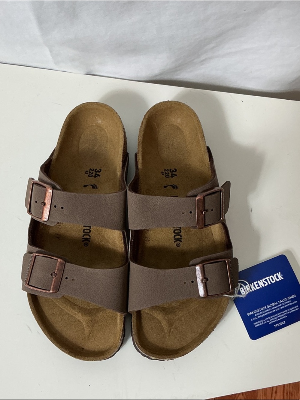 Birkenstock Arizona Two-Strap Sandals in Taupe Brown with Copper Buckles